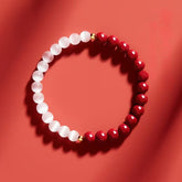 Pulsera de cinabrio y cuentas blancas